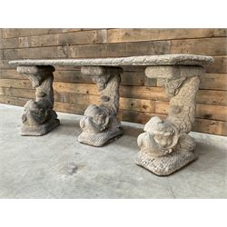 Cast stone four piece curved Dolphin bench, set with three dolphin pillars, curved rectangular slab top with detailed border