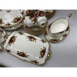 Royal Albert Old Country Roses pattern dinner service for eight, to include dinner plates, side plates, dessert plates, bowls, coffee cups and saucers, two twin handled covered tureens, meat dish, sauce boat and stand, six napkin rings etc (69)