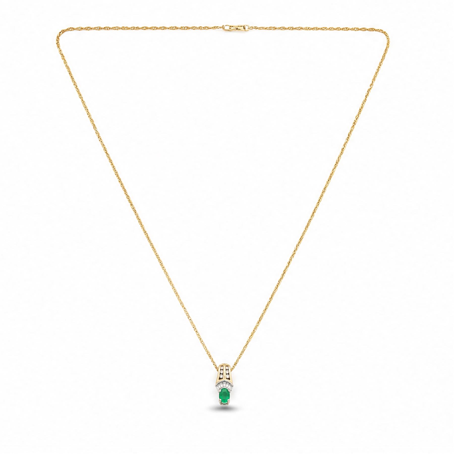14ct white and yellow gold emerald and diamond pendant necklace, five tapered baguette cut diamonds and six round cut diamonds, suspending a single oval cut emerald of approx 0.45 carat, on a Singapore link chain necklace