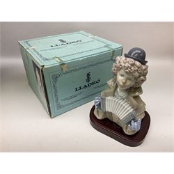 Two Lladro clown figures, comprising Sad Note no 5586, in original box and Fine Melody no 5585, both on a mahogany bases, largest example H18cm 