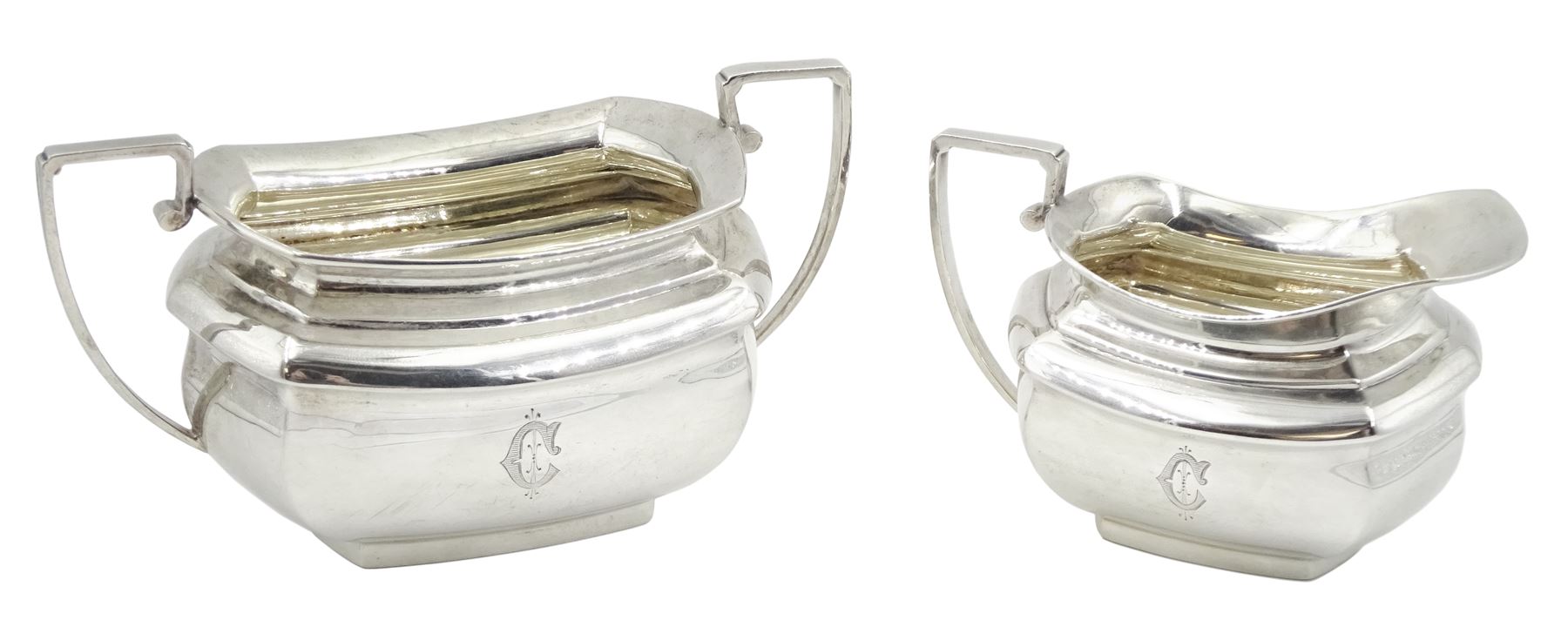 Raich Carter - presentation hallmarked silver two-handled tray of rounded oblong form with gadrooned rim by Wilson & Gill, 139 Regent Street, London, inscribed to the centre 'Presented to Mr. & Mrs. Raich Carter by the Lord Mayor of the City and County of Kingston-upon-Hull Alderman R.E. Smith J.P. on May 30th 1952on behalf of the many Admirers who subscribed to The Lord Mayor's Testimonial Fund in recognition of Raich Carter's genius as a footballer and his services to the City', London 1937 82oz L61cm; together with a hallmarked silver four-piece tea and coffee set by Cooper Bros. & Sons Ltd, the teapot of London shape with ebonised handle and knop, each piece engraved with an initial 'C', Sheffield 1920  60.5oz, teapot L29.5cm