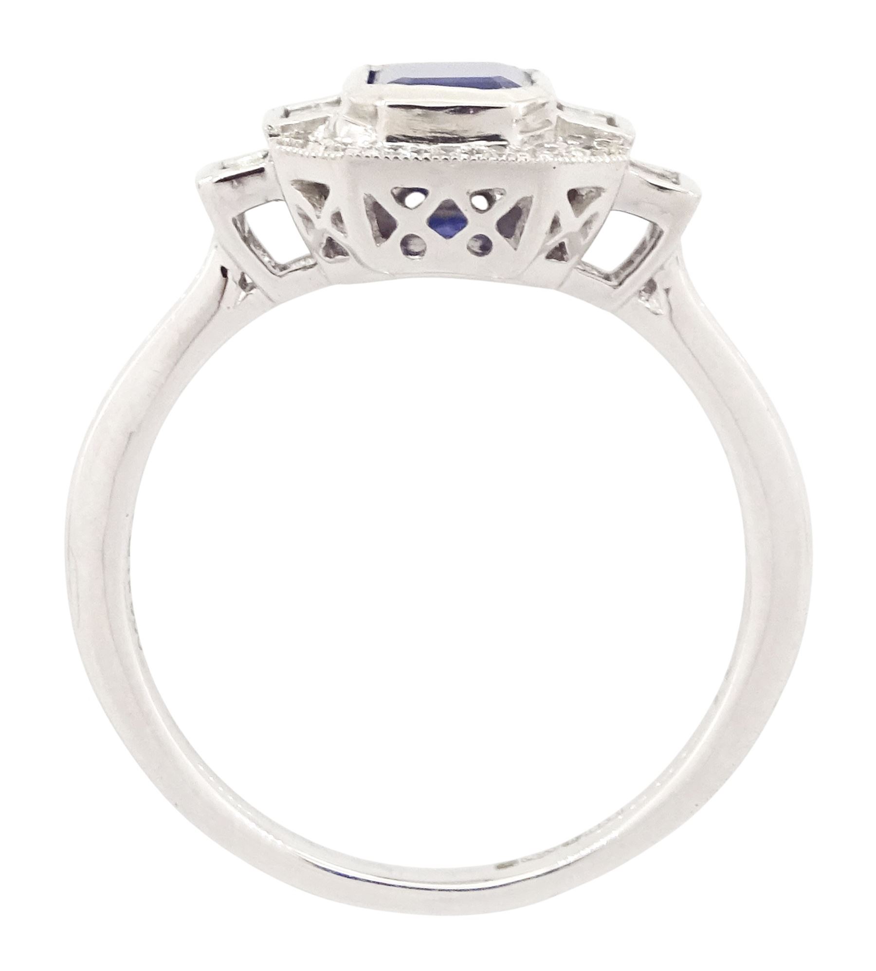 Platinum sapphire and diamond ring, single octagonal cut sapphire of approx 1.15 carat, flanked by two baguette cut diamonds and milgrain set round brilliant cut diamond surround, hallmarked, total diamond weight approx 0.35 carat