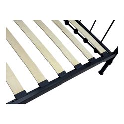 Contemporary Victorian revival black metal day bed, featuring arched back and sides with turned finials and spindle rails, complete with single 'OTTO' mattress