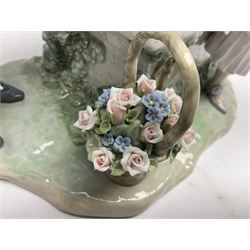 Lladro figure, Will You Marry Me, modelled as a courting couple on a garden bench, sculpted by Salvador Furió, with original box, no 5447, year issued 1987, year retired 1994, H27cm