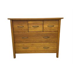 Light oak chest fitted with three small and two large drawers