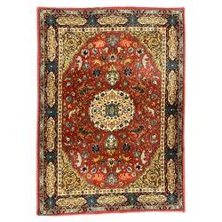Persian design red ground rug, decorated with plant and animal motifs, the border decorated with floral design panels with guards