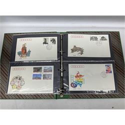 Mostly Chinese stamps including  covers and postcards, many being from the 80s and 90s, housed in ten folders