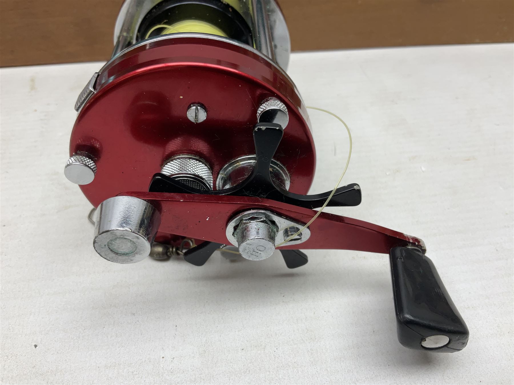 Four Abu fishing reels, comprising Ambassadeur 9000, Ambassadeur 7000, Ambassadeur 5500 and Ambassadeur 6500, together with additional line, hardy fishing bag and two wooden boxes