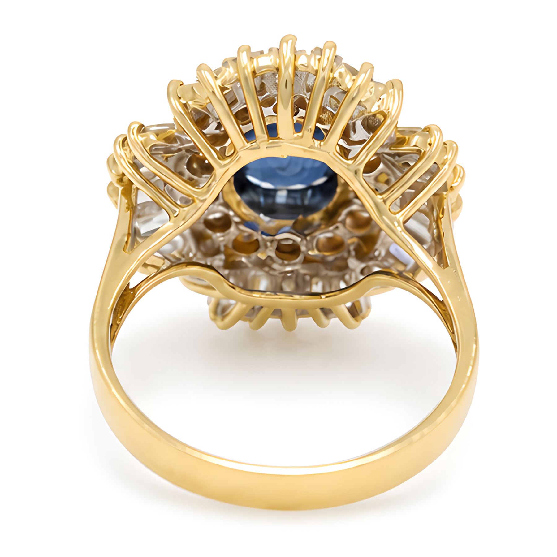 18ct gold sapphire and diamond cluster ring, single oval cut sapphire of approx 2.05 carat, surrounded by two rows of round brilliant cut and baguette cut diamonds, Sheffield import mark 1994, total round cut diamond weight approx 0.55 carat
