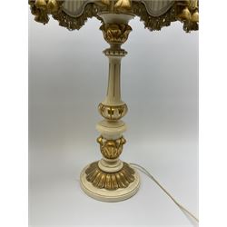 A cream and gilt finished table lamp, the turned base supporting a green pleated and tasselled shade, together with another similar small example, largest including shade, H85cm. 
