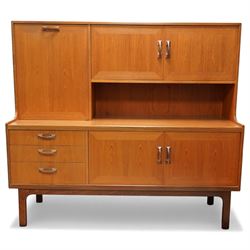 Mid-20th century teak and afromosia high sideboard unit, left hand side is fitted with a f...