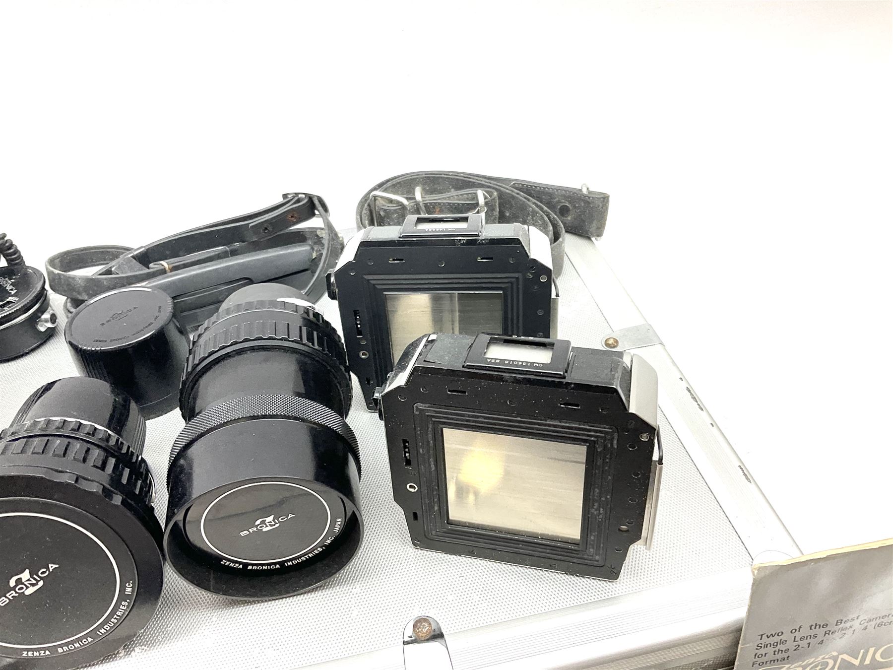 Zenza Bronica S2A medium format camera body, with Zenza Bronica Zenzanon MC '1:2.4 f-80mm' lens, together with Nippon Kogaku Nikkor-P '1:4 f-200mm' lens, Nikkor D.C '1:4 f-40mm' lens, two film backs and other camera equipment, housed in a hard flight case