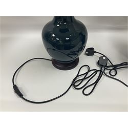 Pair of Chinese teal glazed table lamps, each of bottle form, raised upon circular hardwood bases, including shade H72cm 