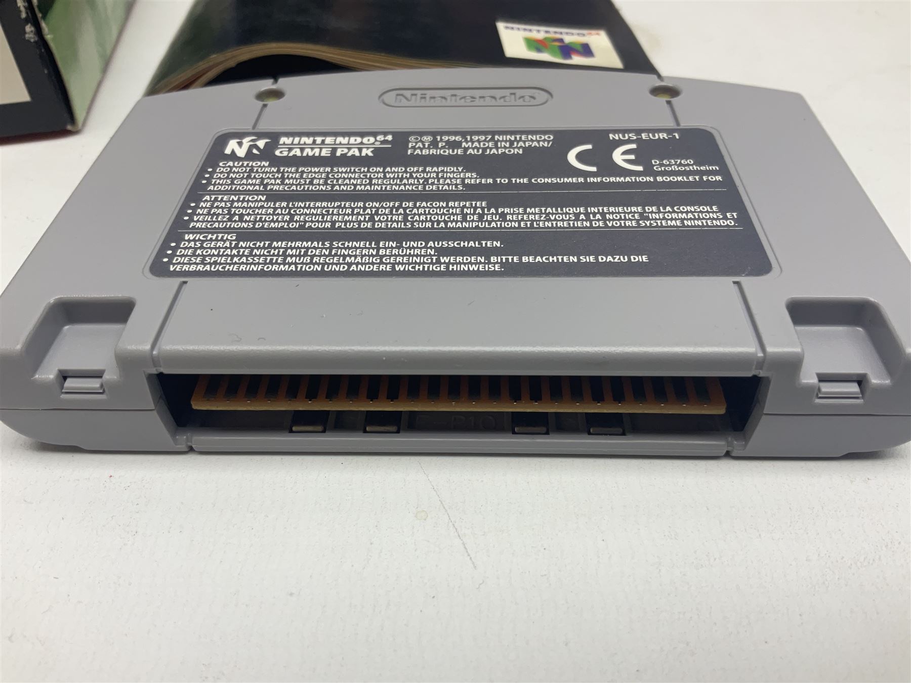 Nintendo 64 console, two controllers, games and accessories. Accessories to include the ‘Tremorpak’ and ‘Spook’ 2 Phono plugs and a S-VHS plug with adapter, both in original boxes. Games to include ‘Golden Eye 007’, ‘Doom 64’, ‘Killer Instinct Gold’, ‘Tetrisphere’, ‘F-1 World Grand Prix’, ‘Pilotwings 64’ and ‘Lylatwars’ with ‘Rumble Pak’, all with original boxes and instruction manuals. ‘Star Wars Episode I Racer’ game cartridge in Shadows of the Empire box. 