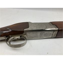 Winchester Japan 5500 12-bore by two-and-three quarters over-and-under double barrel boxlock ejector sporting gun, with 71cm barrels, ventilated rib and barrels, the walnut stock with chequered pistol grip and fore-end, single selective trigger and top safety, serial no.K542927E, L115cm overall; in gun sling SHOTGUN CERTIFICATE REQUIRED