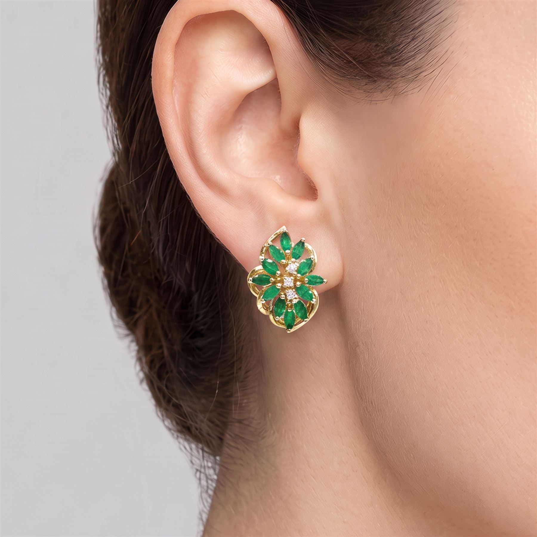 Pair of 14ct gold emerald and diamond cluster earrings, each stud set with twelve marquise cut emeralds and three round brilliant cut diamonds, stamped 585