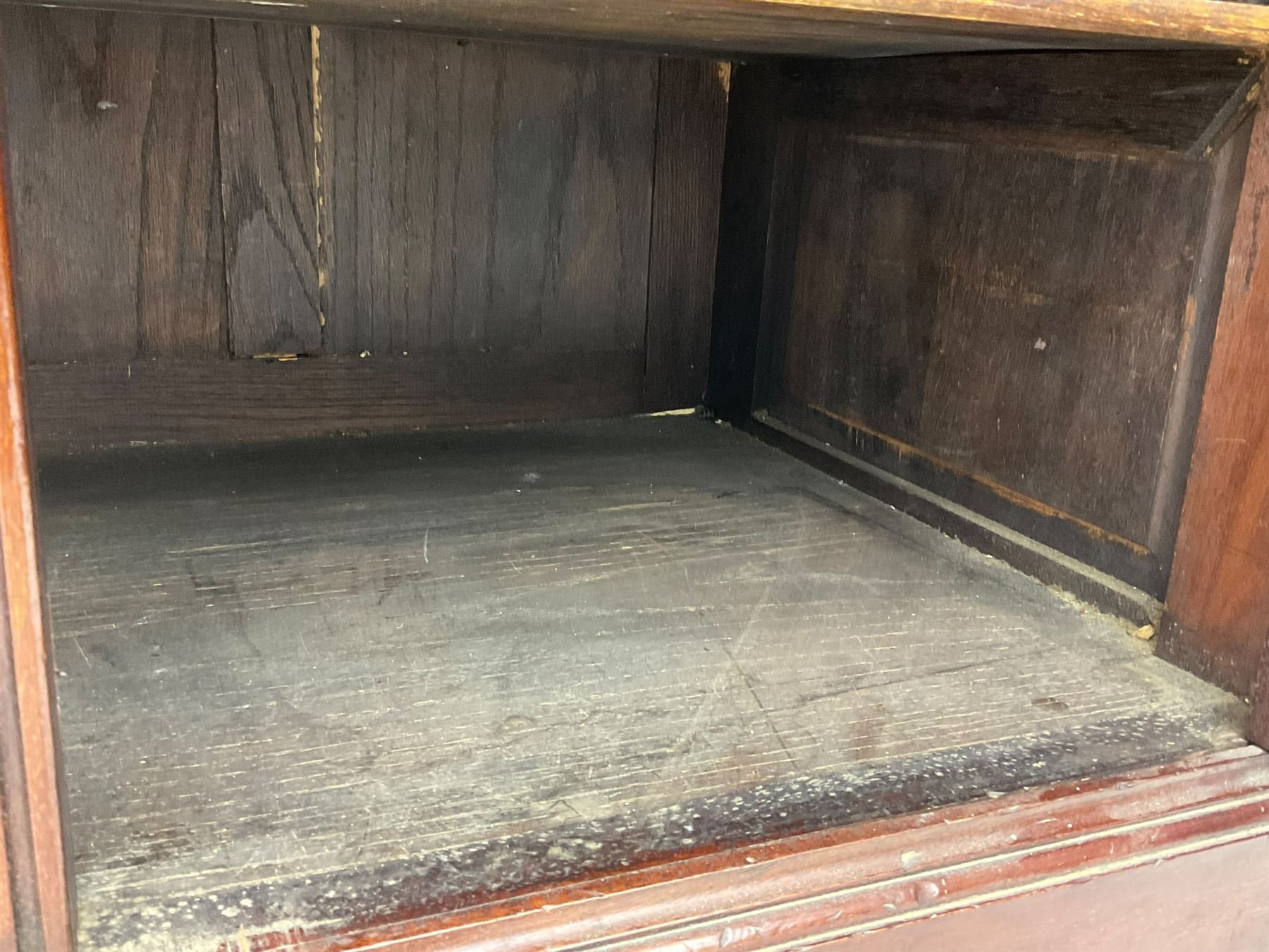 The Shannon Limited - late Victorian walnut filing cabinet, fitted with twenty-four small filing drawers, each with brass handle with label holder, fluted uprights, double cupboard below enclosed by two panelled doors, on turned feet, with brass plaque inscribed 'The Shannon, Limited, Ropemaker St. London, E.C.'