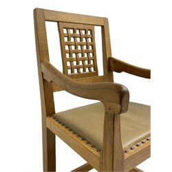 'Rabbitman' set of eight oak dining chairs, pierced lattice backs, upholstered seats with studwork band, octagonal front supports joined by stretchers, carved with rabbit signature, two carvers and six side chairs, by Peter Heap of Wetwang
