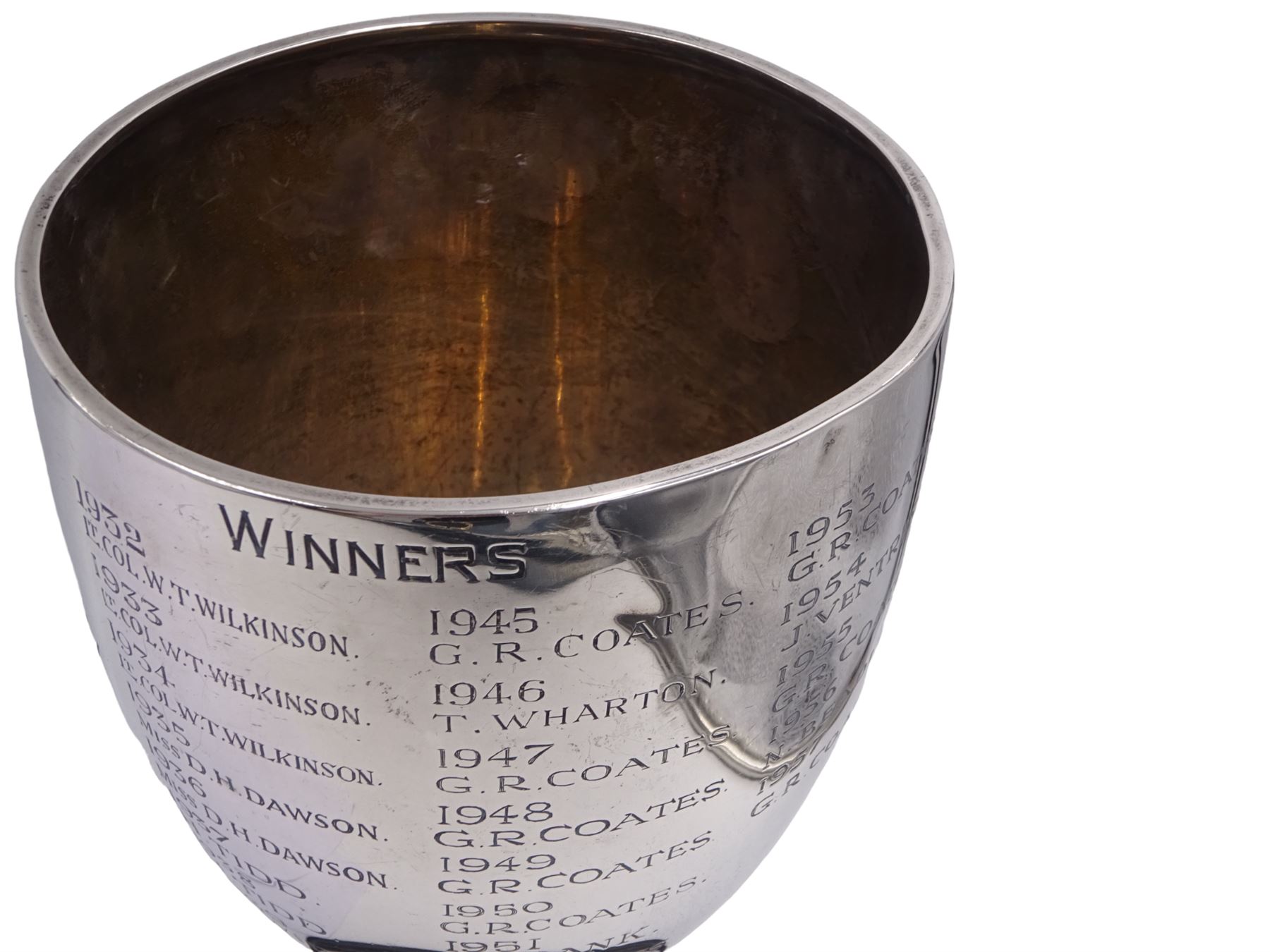 1930s silver trophy cup, of plain form, upon knopped stem and circular stepped foot, body with presentation engraving 'Cloughton and Burniston Sweet Pea Challenge Cup' with winners engraved verso, hallmarked Walker & Hall, Sheffield 1931, upon ebonised base, including base H28.7cm