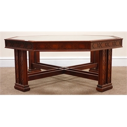  20th century walnut Chinese Chippendale style octagonal coffee table with inset glass top, carved supports joined by stretchers on sledge feet, W97cm, H40cm, D97cm  