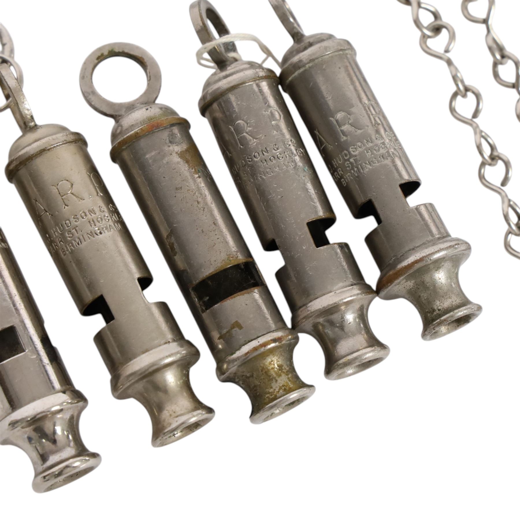 Collection of WWII ARP warden's whistles and similar together with RAF badge and similar 