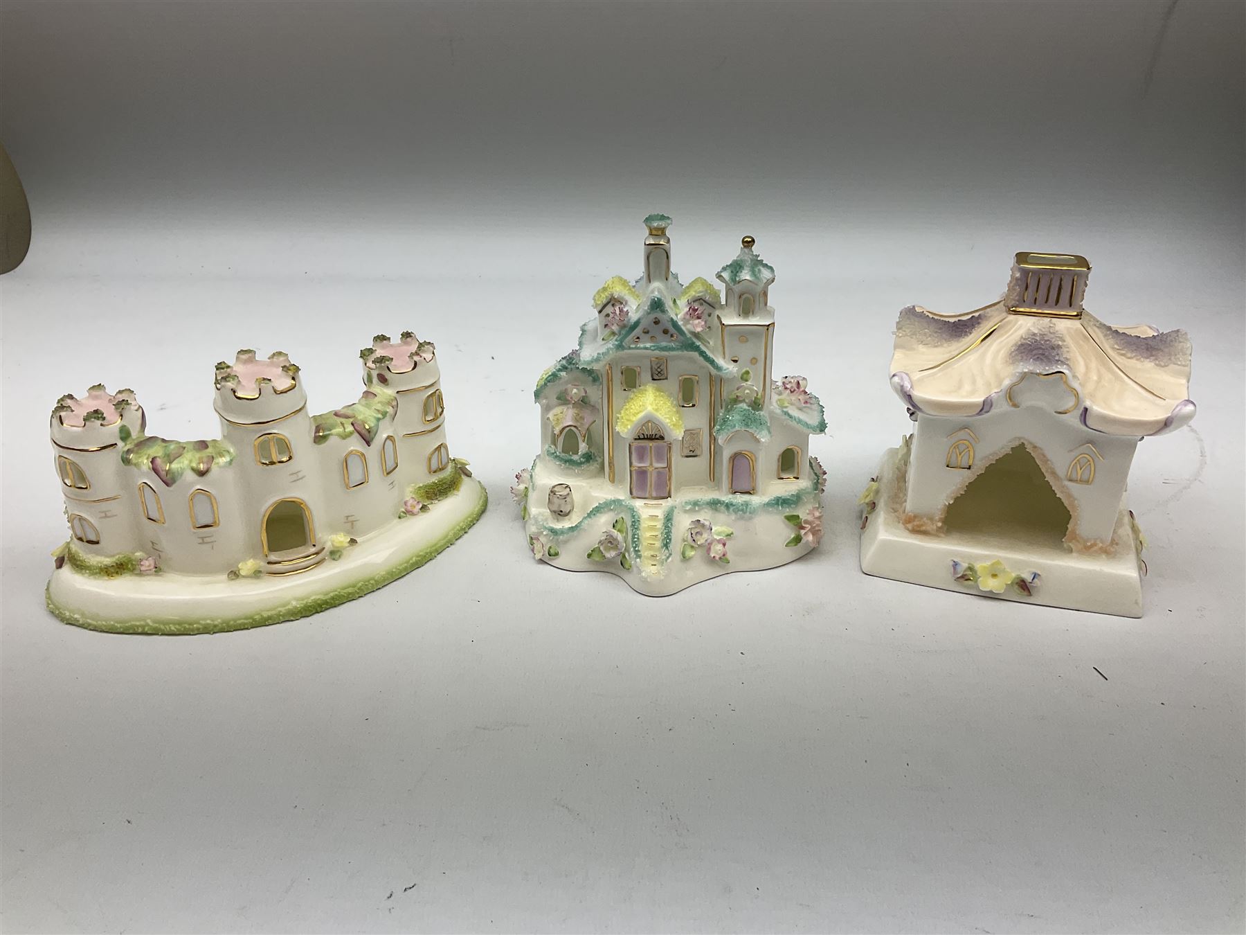 Twelve Coalport bone china pastille burner cottages, to include Fortune Towers, Summer Palace, The Vinery, Springtime Cottage, Dream Villa, Half Moon House, etc, all with original boxes and some with certificates 