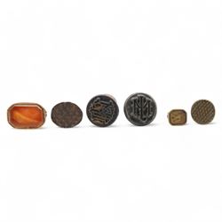 Collection of six 19th century seals, including a pinchbeck seal with cornelian panel, giraffe and others (6)