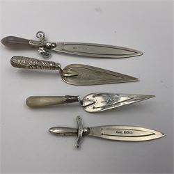 Four novelty silver bookmarks, including two modelled as swords, one with agate handle, and two modelled as cake slices, one with a mother of pearl handle, all hallmarked 