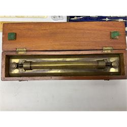 J Halden & Co brass sliding rule in a mahogany box, together with cased wooden ruler set, and other cased drawing sets and equipment 