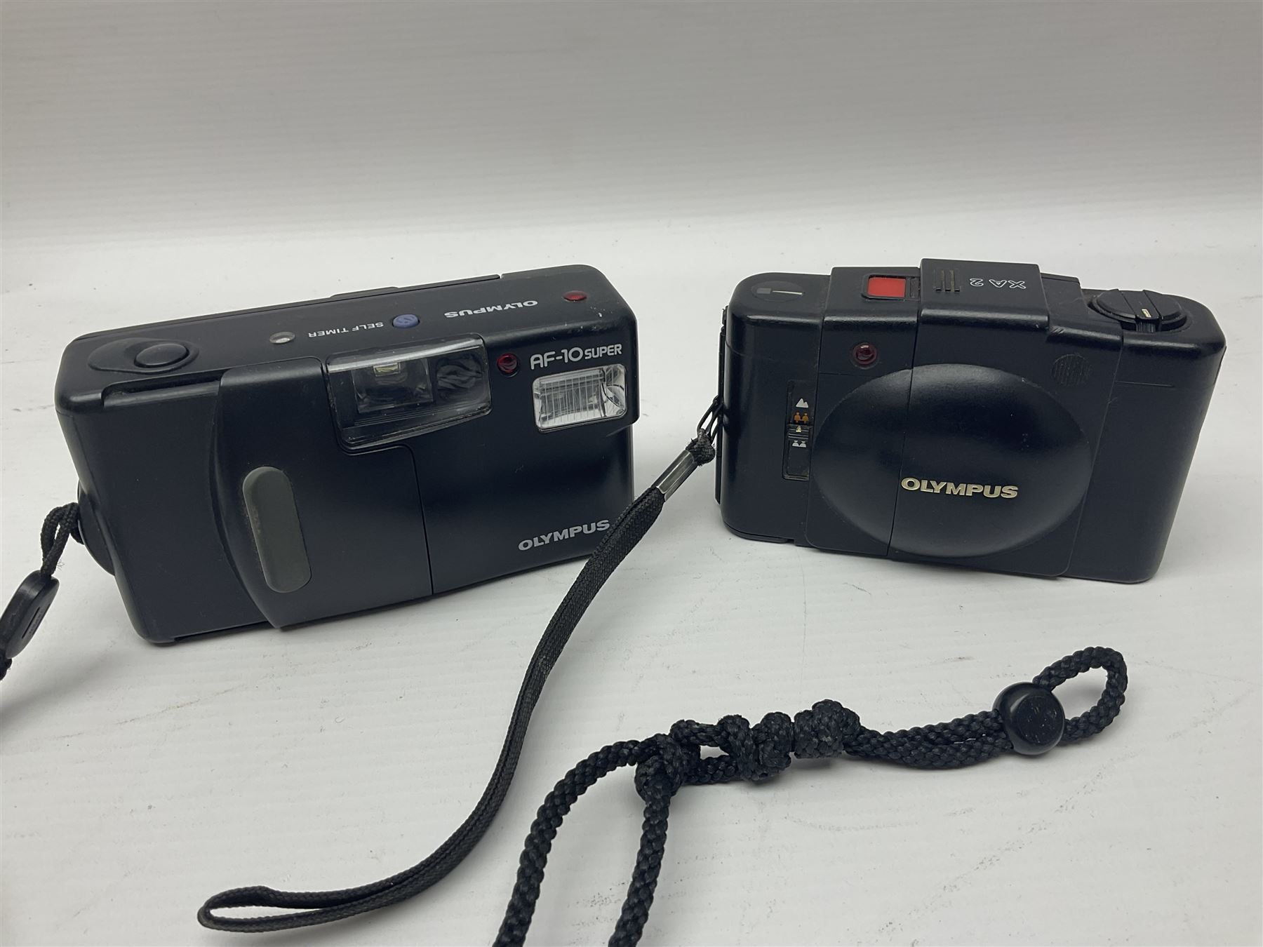 Four Olympus cameras, to include AF10 Super, XA2, Shoot & Go and Supertrip examples, together with Miranda ME-Z and Miranda ME-X DX cameras, an Agfa Optima camera with Agfa Paratonic DIN ASA Solitar 1:2.8/40 lens, Canon Snappy S camera and a Fujifilm Fine Pix S5700 camera, serial no 7WE12368 (8)