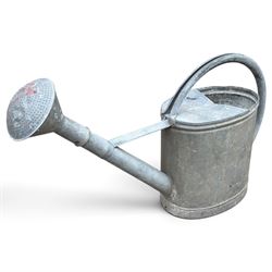 Assorted garden and architectural salvage, comprising a galvanised watering can, two long-handled cutting tools, metal pole, pair of ornate cast iron supports and further decorative fragments