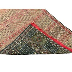 Turkish design red ground rug, decorated with geometric patterns