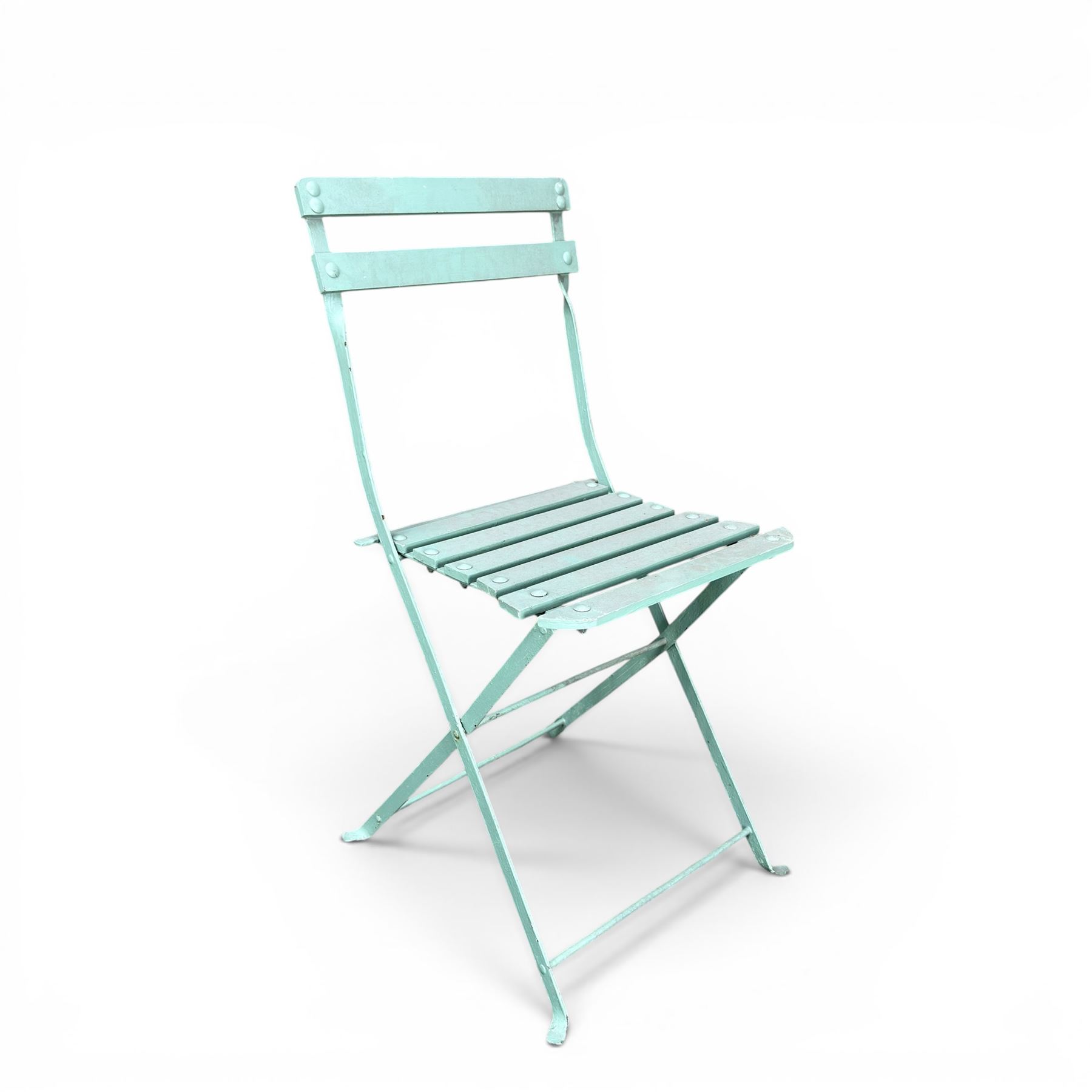 Wrought metal folding garden table, with painted wood plank top; and four matching folding chairs