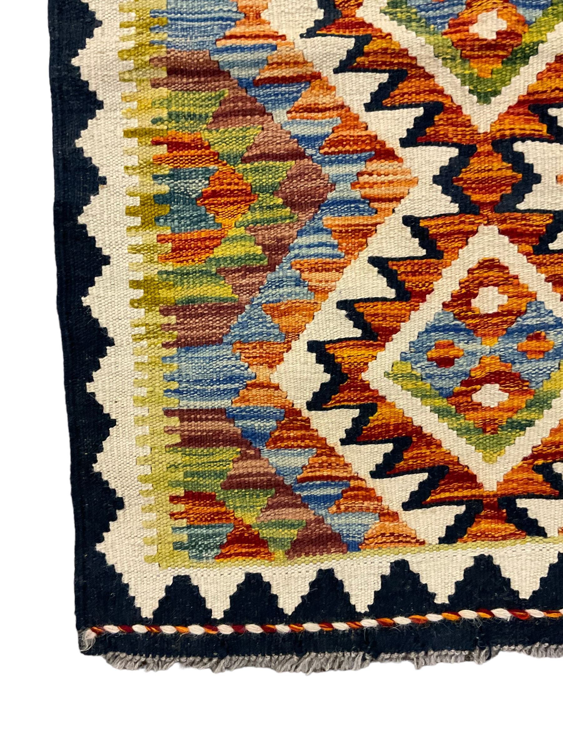 Chobi Kilim runner, geometric design decorated with six lozenges, multi-coloured ground