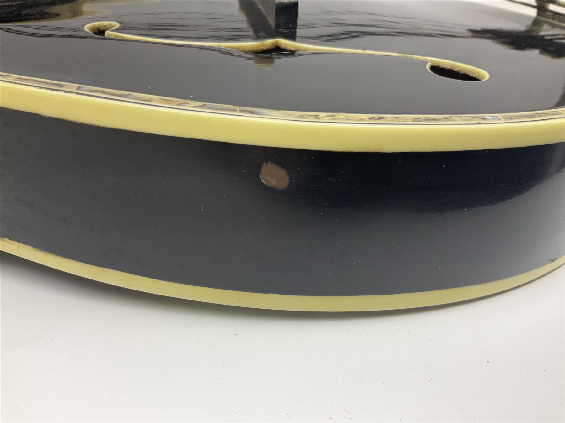 Eastern F-hole eight-string mandolin with black finish and mother-of-pearl inlay of a man riding a winged horse/unicorn amongst clouds and stars with playing card suits to the fingerboard L71cm