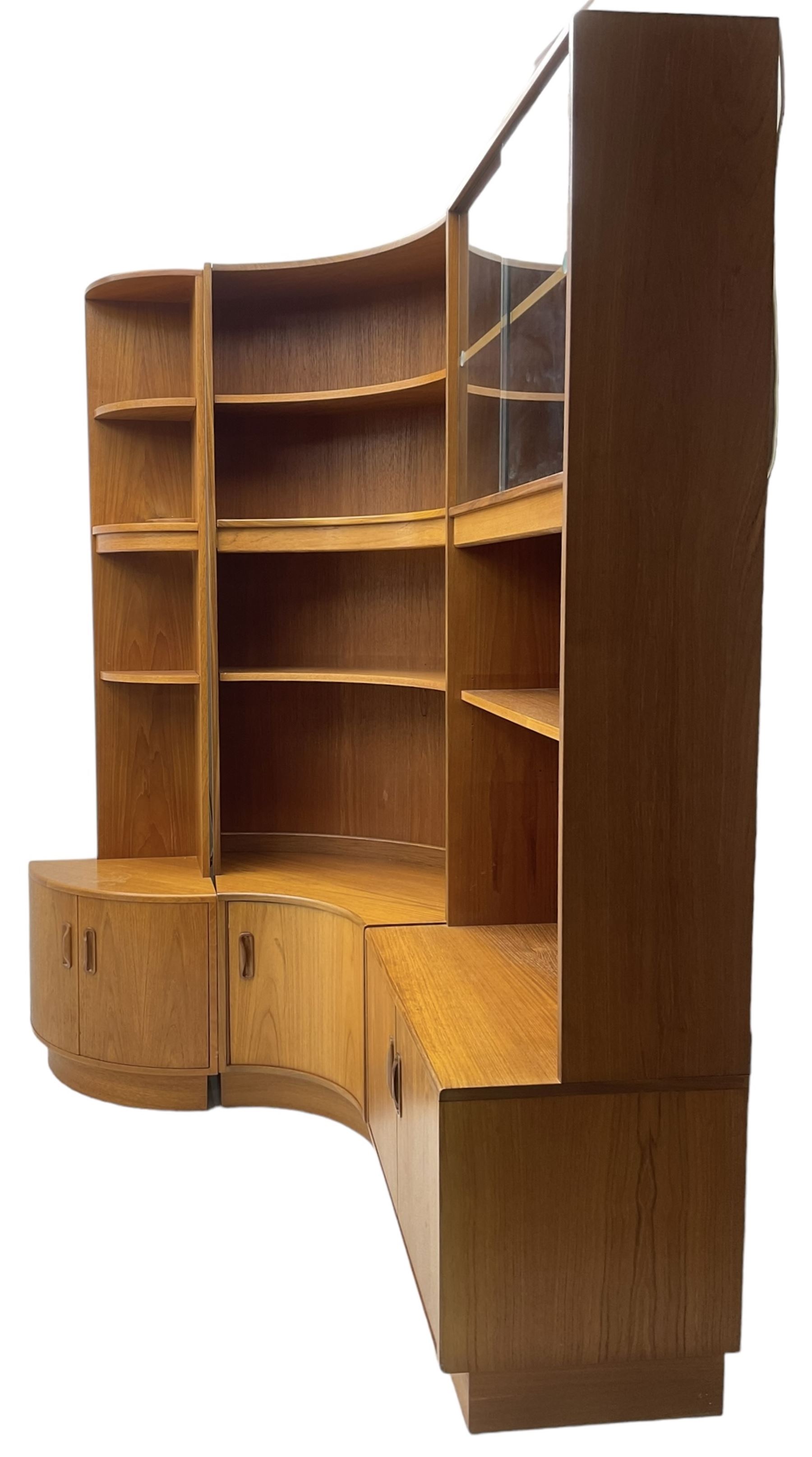 G-Plan - teak three sectional wall unit, fitted with display cabinet enclosed by two sliding glass doors, shelves and cupboards