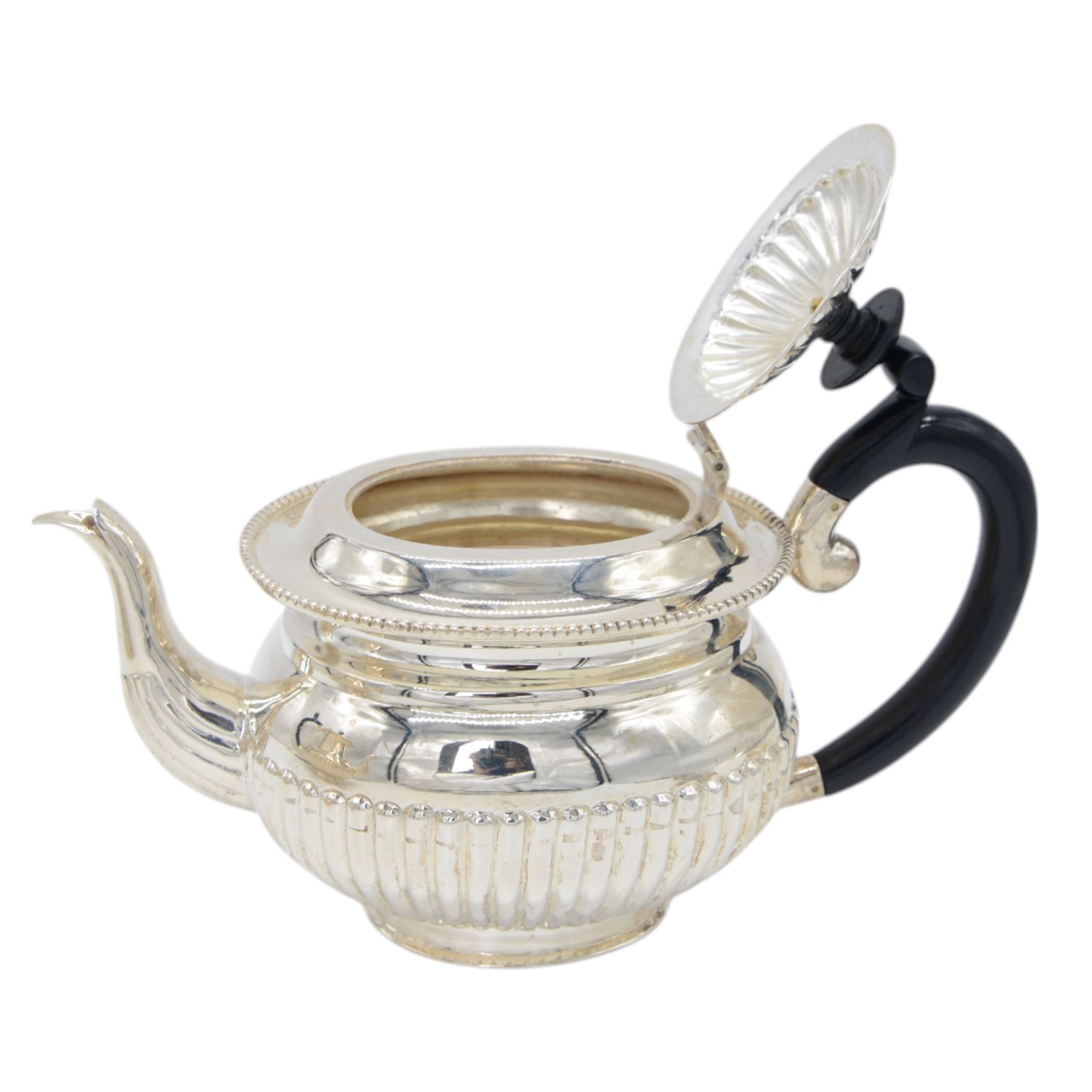 Late 20th century Indian Colonial silver six piece tea and coffee service, comprising coffee pot, hot water pot, teapot, milk jug, open sucrier and tray, all of oval part fluted form, the tea and coffee pot with ebonised wooden handles and finials, stamped SIL and with maker's mark for Cooke & Kelvey New Dehli, within two boxes and with original receipt for 1999