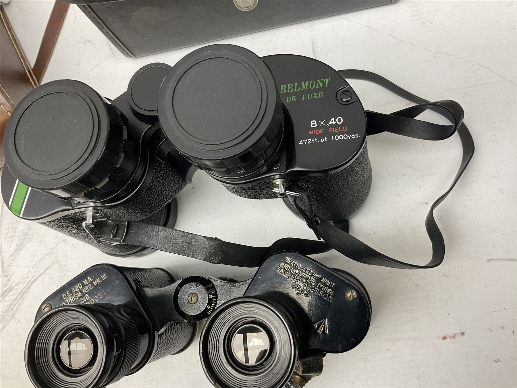 Eleven pairs of binoculars, to include Zeiss Wetzler 20x50, Taylor-Hobson Bino Prism No.2 Mk.III military stamped 1943 with broad arrow,  Swift Tecnar 16x50, J.T Coppock Oceanic Bloomed 10x50, Hensoldt Wetzlar Dialyt 7x42 etc