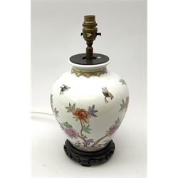 A ceramic table lamp, of ovoid form decorated in the Oriental style with blossoming flowers and butterflies, including fixture H34cm. 
