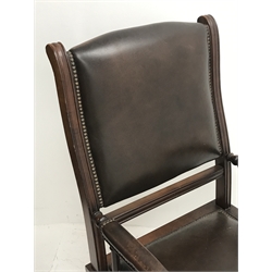 *19th century mahogany framed American rocking armchair, seat, back and arms upholstered in brown studded leather, turned arm supports, W59cm, H106cm
