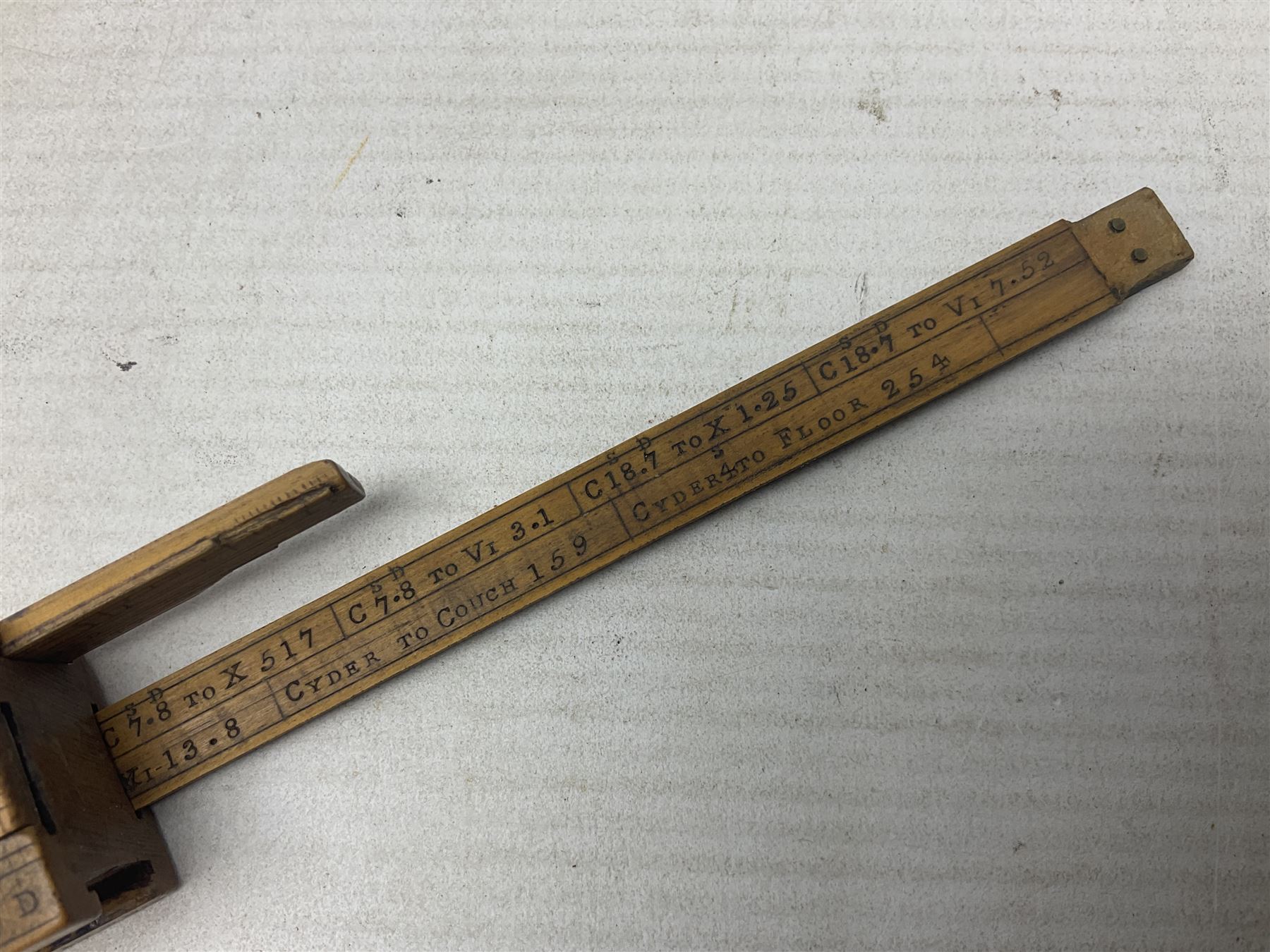 Late 18th/early 19th century boxwood ruler with four slides, for use by Customs &. Excise in the brewery trade; scales on all four sides each having a central slide with divisions on either side;  possibly made by 'E. Roberts, Dove Court, Old Jewry, London' (Edward Roberts (I) 1749-1776 & Edward Roberts (II) 1788-1795) L30.5cm