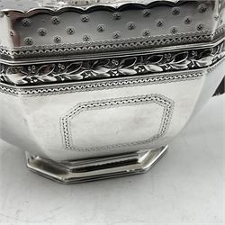 Victorian silver four piece tea service, comprising teapot, teapot stand, twin handled open sucrier and milk jug, each of octagonal form with foliate bud border and engraved decoration including crest to canted panels, and vacant panels, the teapot with ivory finial to the hinged cover and later wooden handle, hallmarked Edward Barnard & Sons Ltd, London1896, teapot including finial H15cm, milk jug including handle H16cm, teapot stand W11.5cm

This item has been registered for sale under Section 10 of the APHA Ivory Act