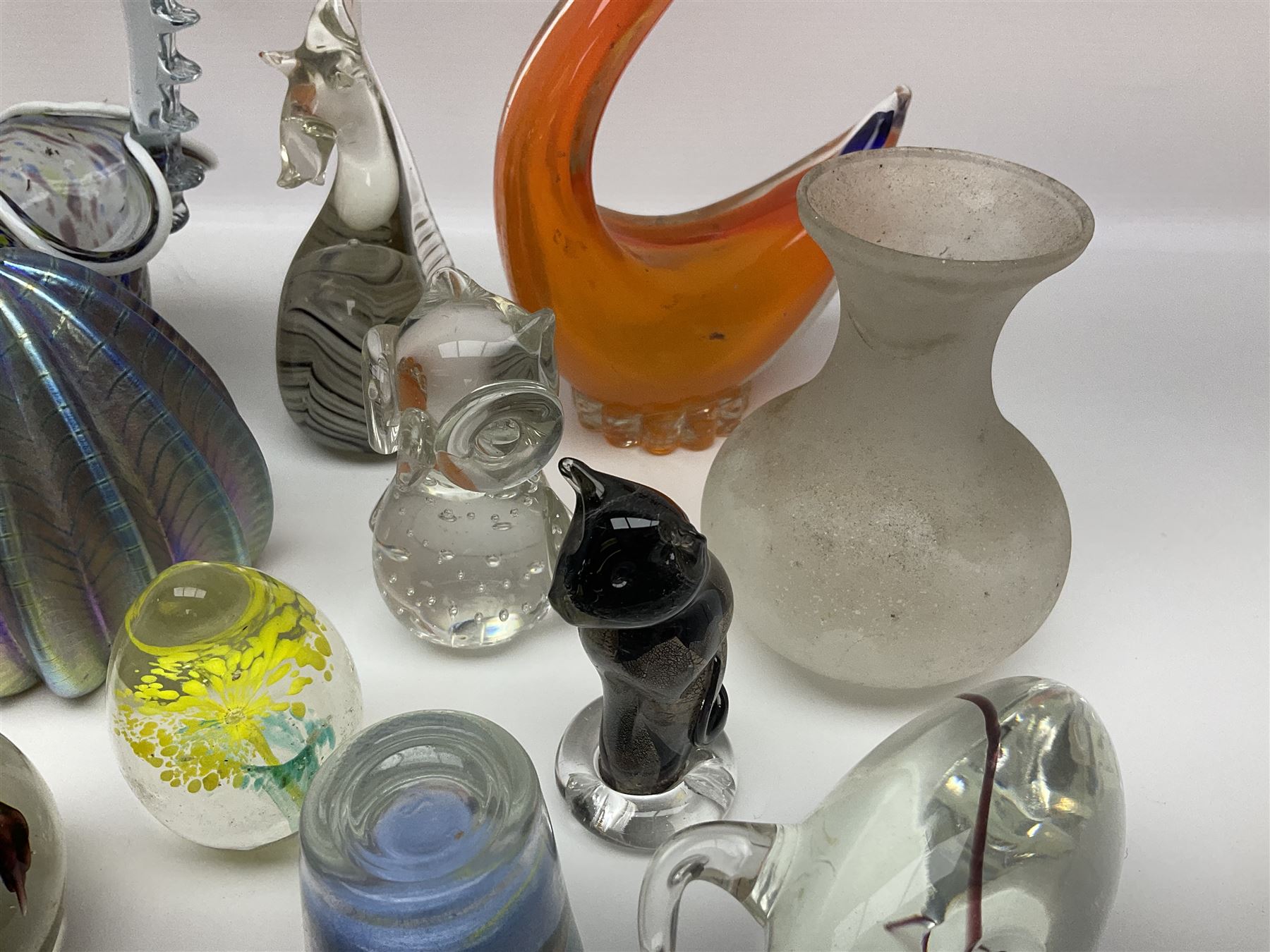 Robert Held iridescent art glass sea urchin paperweight, signed to underside, together with Murano glass clown and a collection of other glass paperweights and animals, etc 