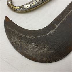 Moroccan jambiya dagger with 24.5cm plain curved blade stamped LONDON to the ricasso area, the hilt and scabbard overlaid with plain sheet brass to the back and ornate silver coloured metal to the front; waisted grip and arched pommel; two pyramid mounts to the scabbard L41cm overall; large billhook with curving blade and stacked leather washer grip; and a reproduction halberd blade (3)