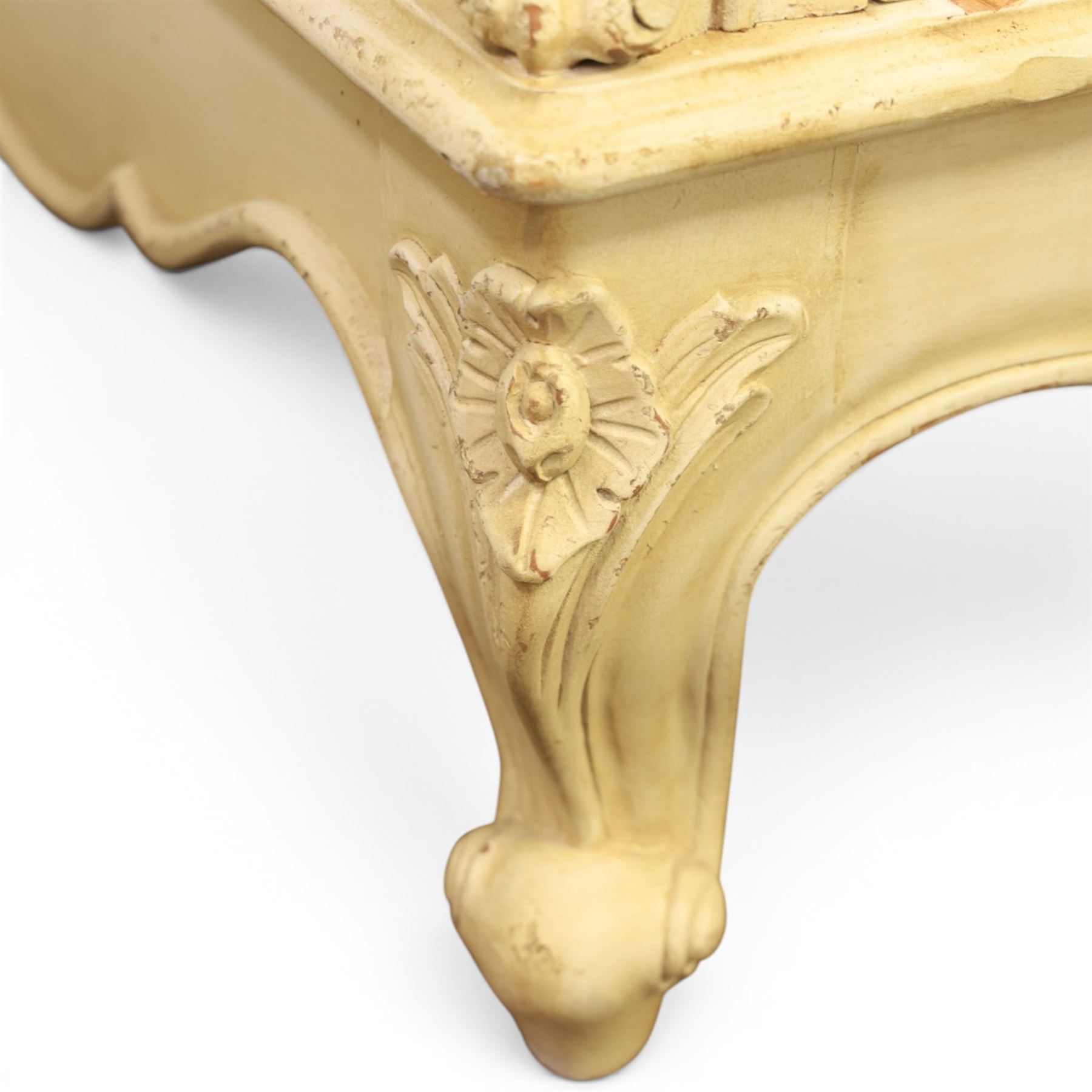 French Louis XV design cream painted double armoire, serpentine moulded pediment surmounted by carved foliate crest, enclosed by two shaped panel doors with applied scroll and leaf mouldings, enclosing a hanging rail and adjustable shelving, fluted uprights with carved floral terminals, on shaped apron and cabriole feet