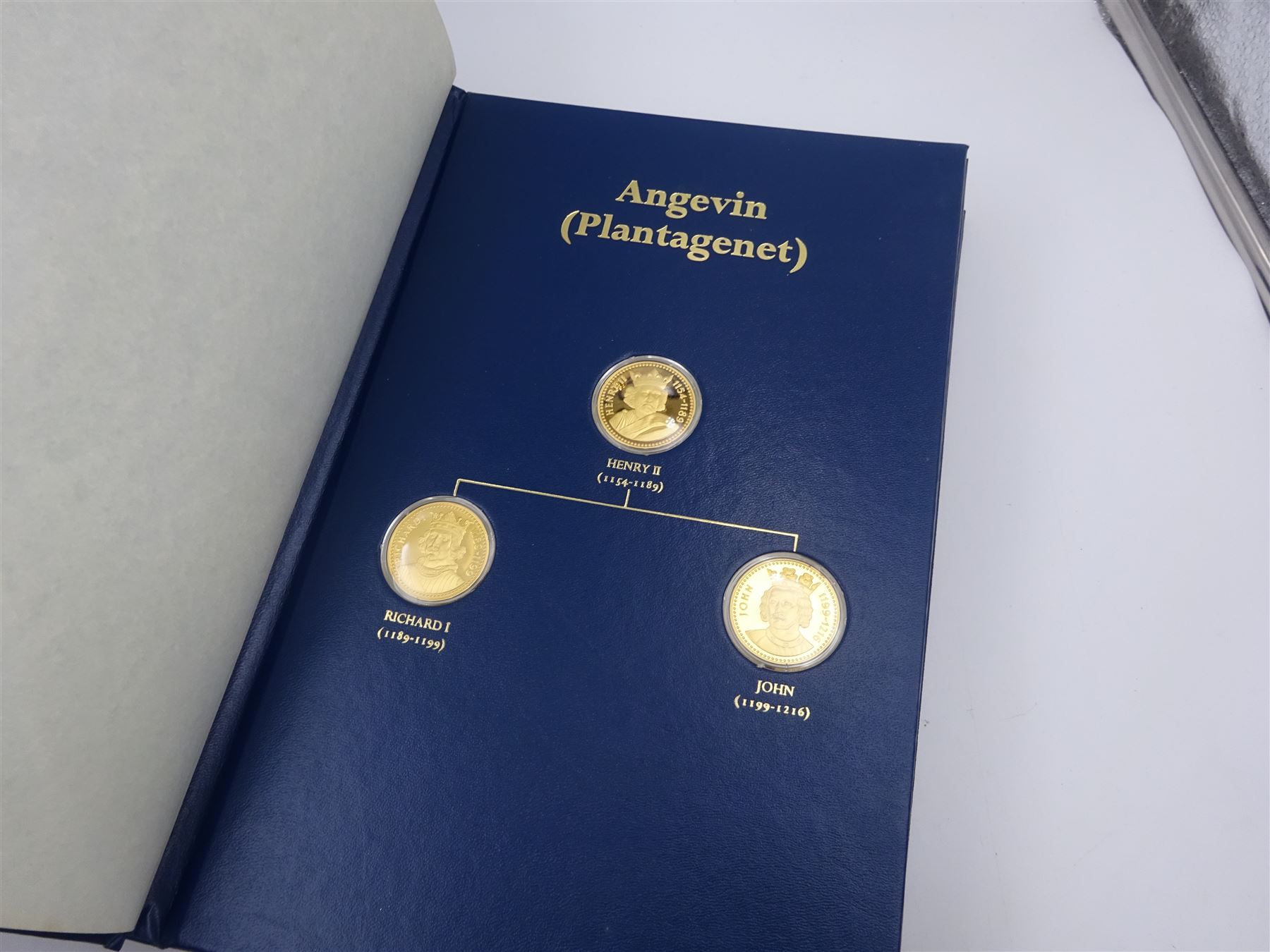 Franklin Mint, The Kings and Queens Collection, forty-three 24ct gold plated silver medallions, each engraved RSBS First Edition Silver Jubilee 1977 and hallmarked Franklin Mint, London 1978, contained within blue presentation folder
