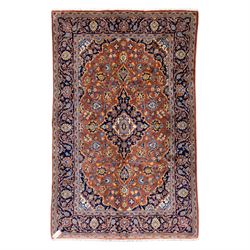 Central Persian Kashan hand-knotted rug,  terracotta field with central shaped ivory and d...