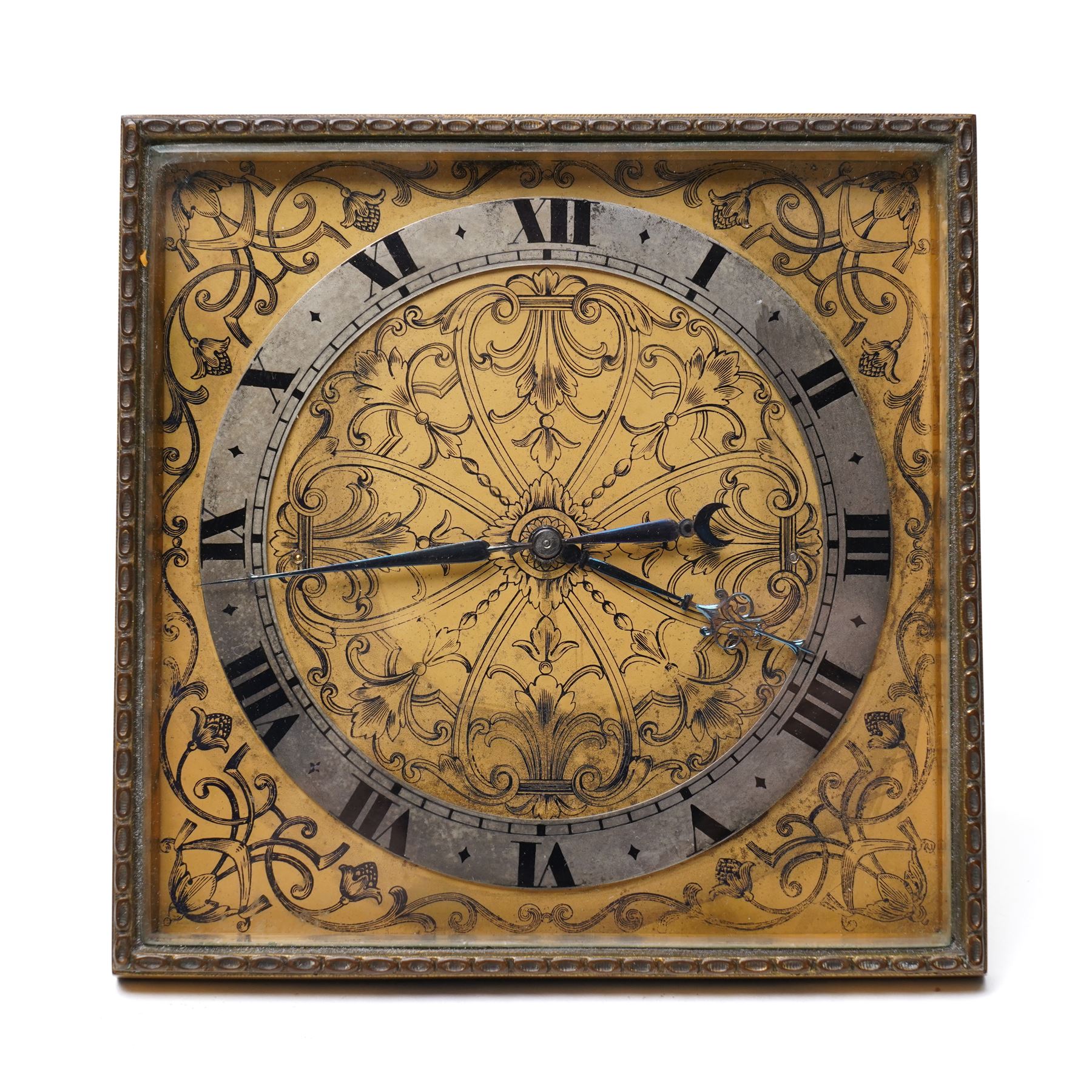 Early 20th century-Swiss bedside Strut Clock with an 8-day timepiece movement and balance escapement, four and a half inch square picture frame case with fine detail surround, gilt dial with exquisitely etched engraving to the corners and centre, silvered chapter with Roman numerals, inner minute track and elegantly fettled blue steel hands, wound and set from the rear.