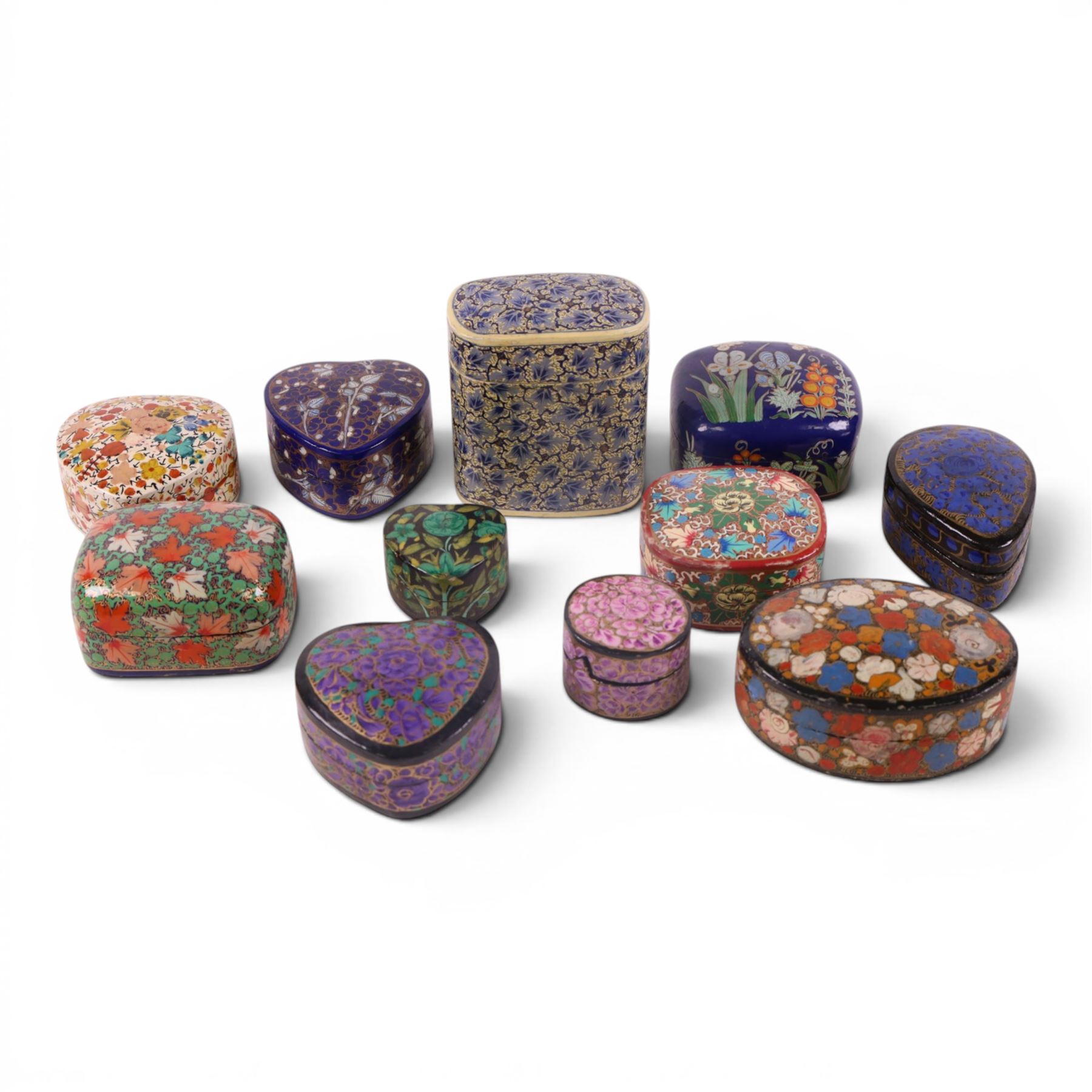 Collection of eleven lacquered boxes, mainly Indian, decorated with floral motifs, tallest H10cm 