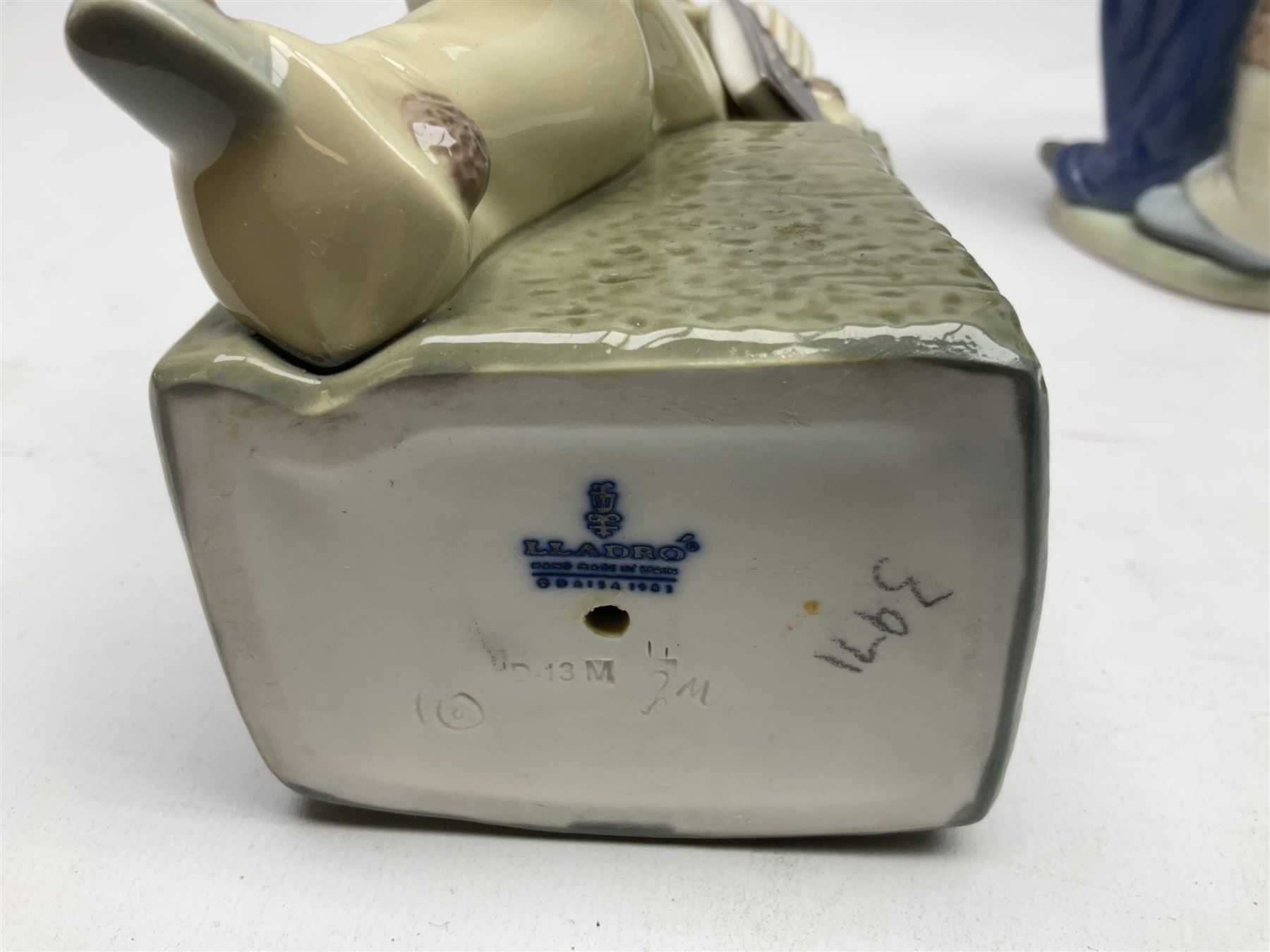 Three Lladro figures, comprising Little Jester no 5203, Pals Forever no 7686 and Naughty Girl no 5006, H25cm